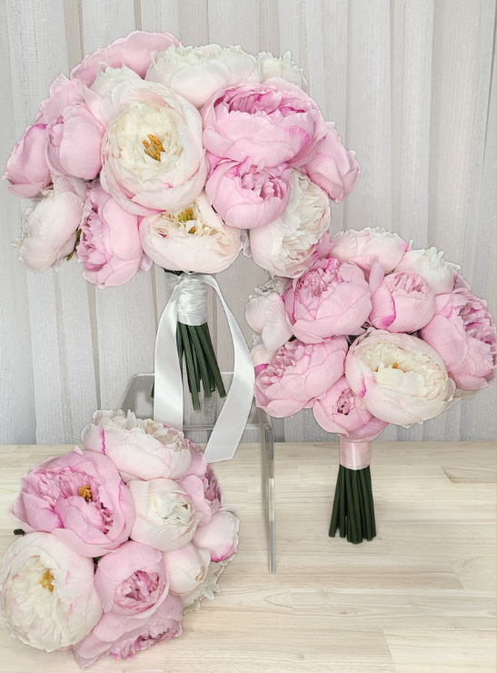 Artificial wedding rounded bouquet with pink and ivory faux peonies, golden flower centres and white ribbon tails. Made in Melbourne by Flowers For Ever After, shipping Australia and Worldwide.