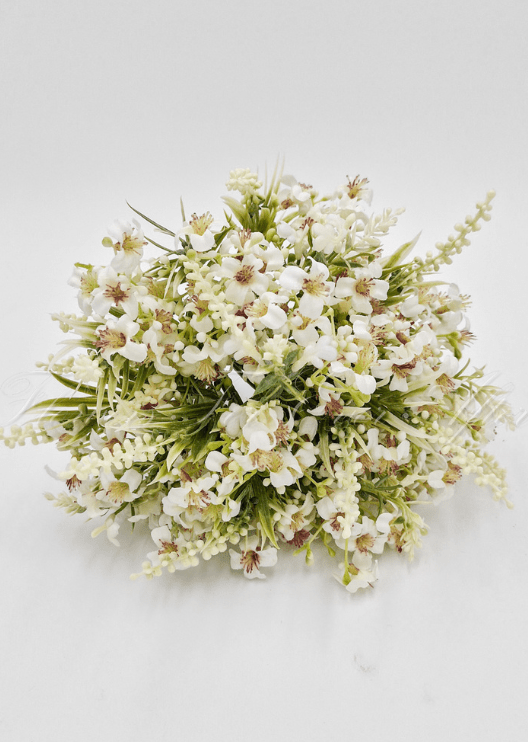 Artificial wedding bouquet of white faux roses, rounded white blooms, small flowers and green sprigs. Made in Melbourne by Flowers For Ever After, shipping Australia and Worldwide.