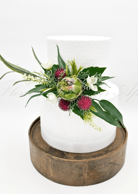 Artificial wedding cake flower pieces with white faux waratah and native-style foliage. For birthday, event and celebration cakes. Made in Melbourne by Flowers For Ever After, shipping Australia and Worldwide.