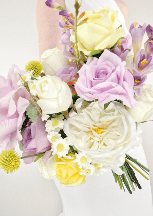 Artificial wedding bridesmaid bouquet, angled view of lilac faux roses, white peonies, yellow roses and small daisies. Made in Melbourne by Flowers For Ever After, shipping Australia and Worldwide.