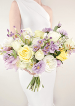 Artificial wedding bridal bouquet, handheld angled view of lilac, yellow and white faux roses with white peonies and purple flowers. Made in Melbourne by Flowers For Ever After, shipping Australia and Worldwide.