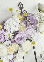 Artificial wedding arbor flower close-up with lilac and cream faux roses, white hydrangea, white daisies and yellow pompom flowers. Made in Melbourne by Flowers For Ever After, shipping Australia and Worldwide.
