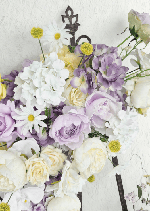Artificial wedding arbor flower close-up with lilac and cream faux roses, white hydrangea, white daisies and yellow pompom flowers. Made in Melbourne by Flowers For Ever After, shipping Australia and Worldwide.