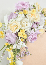 Artificial wedding sign flower close-up with lilac and cream faux roses, white blooms, small yellow flowers and lilac blossoms. Made in Melbourne by Flowers For Ever After, shipping Australia and Worldwide.