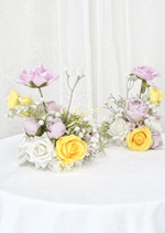 Artificial wedding pair of small table arrangements with lilac, yellow and white faux roses and fine branching flower sprigs. Made in Melbourne by Flowers For Ever After, shipping Australia and Worldwide.
