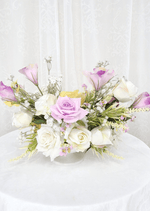 Artificial wedding table centrepiece, reverse view of lilac and white faux roses, yellow blooms and fine pale sprigs. Made in Melbourne by Flowers For Ever After, shipping Australia and Worldwide.