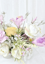 Artificial wedding table flower close-up with white and lilac faux roses, yellow petals, tiny lilac blossoms and pale sprigs. Made in Melbourne by Flowers For Ever After, shipping Australia and Worldwide.