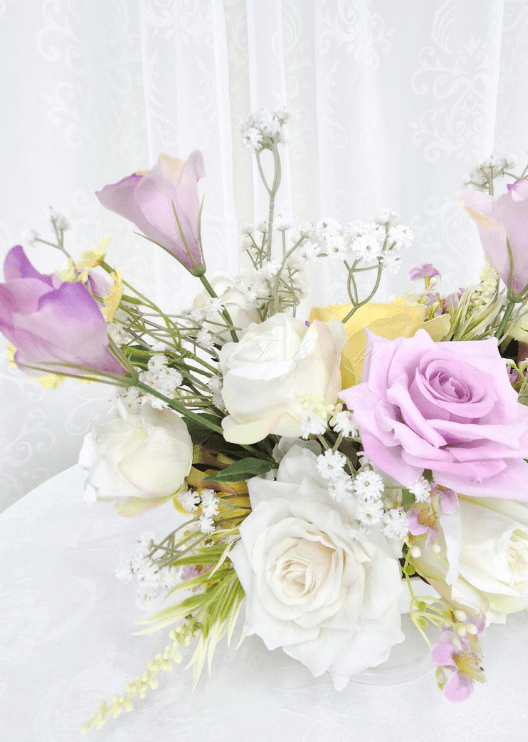 Artificial wedding table flower detail showing lilac and white faux roses, yellow petals and fine white branching flowers. Made in Melbourne by Flowers For Ever After, shipping Australia and Worldwide.