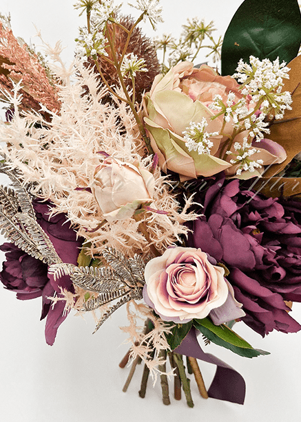 Artificial wedding bouquet with mixed faux flowers, green leaves and a ribbon-wrapped handle. Made in Melbourne by Flowers For Ever After, shipping Australia and Worldwide.