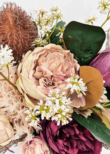 Artificial wedding bouquet close-up showing layered faux flower petals and green foliage. Made in Melbourne by Flowers For Ever After, shipping Australia and Worldwide.