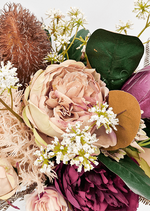 Artificial wedding bouquet close-up showing layered faux flower petals and green foliage. Made in Melbourne by Flowers For Ever After, shipping Australia and Worldwide.
