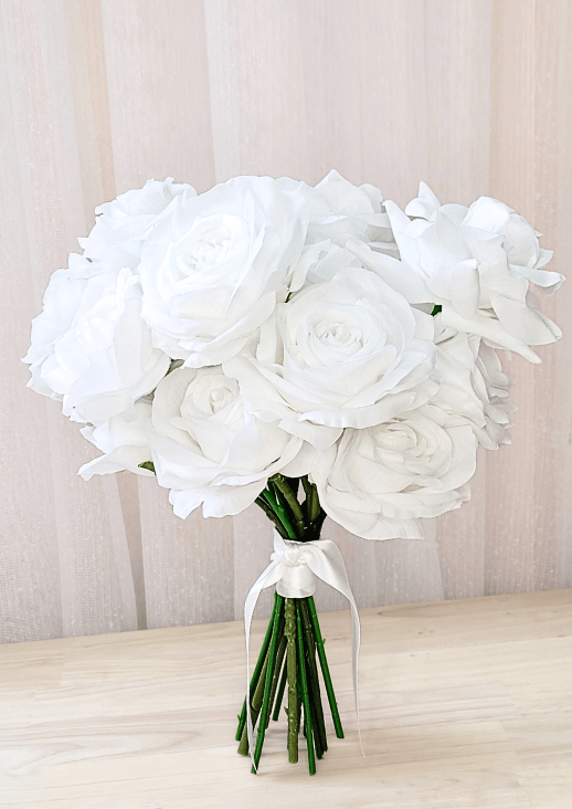 Artificial wedding bridesmaid bouquet with white faux roses and peonies, exposed green stems and an ivory-wrapped handle. Made in Melbourne by Flowers For Ever After, shipping Australia and Worldwide.