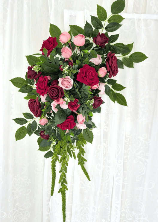 Artificial wedding large hanging arbor spray with red, burgundy and pink faux roses, small white sprigs and long trailing green floral strands. Made in Melbourne by Flowers For Ever After, shipping Australia and Worldwide.
