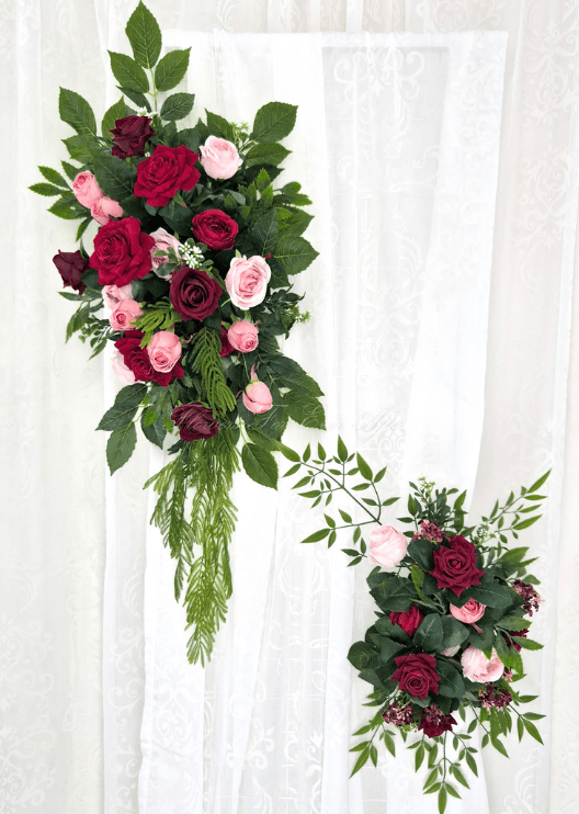 Artificial wedding arbor floral set with a large hanging spray and smaller cluster of red, burgundy and pink faux roses and green foliage. Made in Melbourne by Flowers For Ever After, shipping Australia and Worldwide.