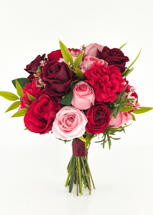 Artificial wedding bridesmaid bouquet with pink, red and burgundy faux roses, red carnations, small pink blossoms and burgundy-wrapped stems. Made in Melbourne by Flowers For Ever After, shipping Australia and Worldwide.