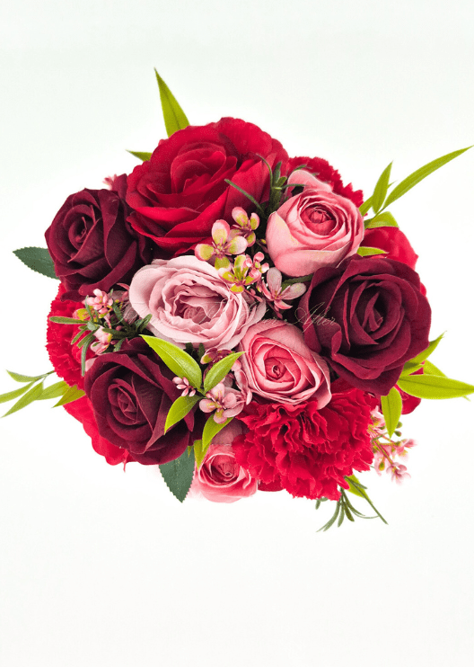 Artificial wedding bridesmaid bouquet, overhead view of pink, red and burgundy faux roses, red carnations and tiny pink blossoms. Made in Melbourne by Flowers For Ever After, shipping Australia and Worldwide.