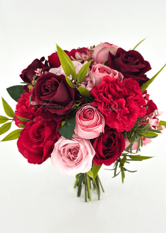 Artificial wedding bridesmaid bouquet, front view of pink, red and burgundy faux roses, red carnations and bright green foliage. Made in Melbourne by Flowers For Ever After, shipping Australia and Worldwide.