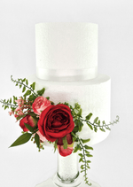 Artificial wedding cake decoration with a red faux rose, pink rosebuds, small pink flowers and spreading green sprigs on the lower tier. For birthday, event and celebration cakes. Made in Melbourne by Flowers For Ever After, shipping Australia and Worldwide.