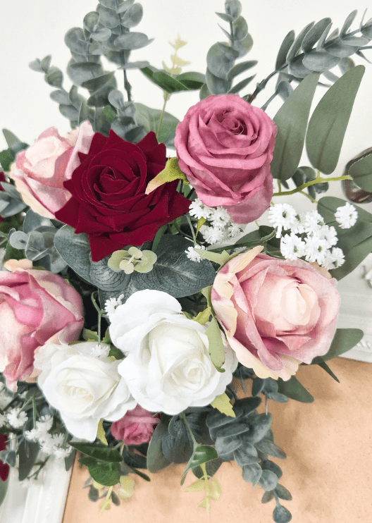 Artificial wedding sign flower close-up with burgundy, pink and white faux roses, tiny white flowers and rounded eucalyptus. Made in Melbourne by Flowers For Ever After, shipping Australia and Worldwide.