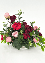 Artificial wedding table centrepiece, front view of pink and burgundy faux roses, red carnations, white flower sprigs and green foliage. Made in Melbourne by Flowers For Ever After, shipping Australia and Worldwide.