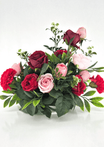 Artificial wedding table centrepiece with pink, red and burgundy faux roses, red carnations, small white flower sprigs and green leaves. Made in Melbourne by Flowers For Ever After, shipping Australia and Worldwide.