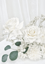Artificial wedding table flower close-up with white faux roses, white pompom bloom, fine white sprigs and eucalyptus. Made in Melbourne by Flowers For Ever After, shipping Australia and Worldwide.