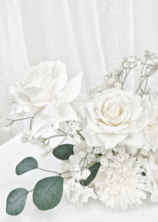 Artificial wedding table flower close-up with white faux roses, white pompom bloom, fine white sprigs and eucalyptus. Made in Melbourne by Flowers For Ever After, shipping Australia and Worldwide.