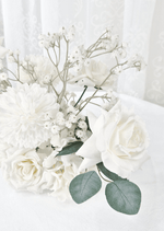 Artificial wedding table flower close-up with a white faux rose, white pompom bloom, tiny white sprigs and eucalyptus. Made in Melbourne by Flowers For Ever After, shipping Australia and Worldwide.