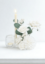 Artificial wedding small table arrangement with white faux roses, white pompom bloom and rounded eucalyptus leaves beside candles. Made in Melbourne by Flowers For Ever After, shipping Australia and Worldwide.