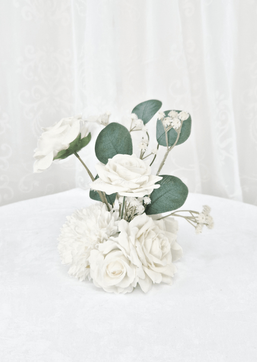 Artificial wedding small table arrangement, reverse view of white faux roses, white pompom bloom, fine sprigs and eucalyptus. Made in Melbourne by Flowers For Ever After, shipping Australia and Worldwide.