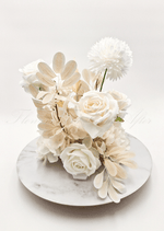 Artificial wedding table arrangement close-up showing white faux roses, clustered blooms and green leaves. Made in Melbourne by Flowers For Ever After, shipping Australia and Worldwide.