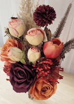 Artificial wedding bouquet close-up with cream-pink faux rosebuds, orange and burgundy roses, red spiky blooms and burgundy chrysanthemum. Made in Melbourne by Flowers For Ever After, shipping Australia and Worldwide.