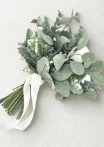 Artificial wedding bridal bouquet, angled view of ivory and white faux roses surrounded by blue-grey eucalyptus leaves. Made in Melbourne by Flowers For Ever After, shipping Australia and Worldwide.