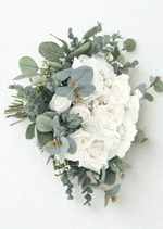 Artificial wedding bridal bouquet, rear view showing eucalyptus leaves, white faux rosebuds and ribbon-wrapped stems. Made in Melbourne by Flowers For Ever After, shipping Australia and Worldwide.