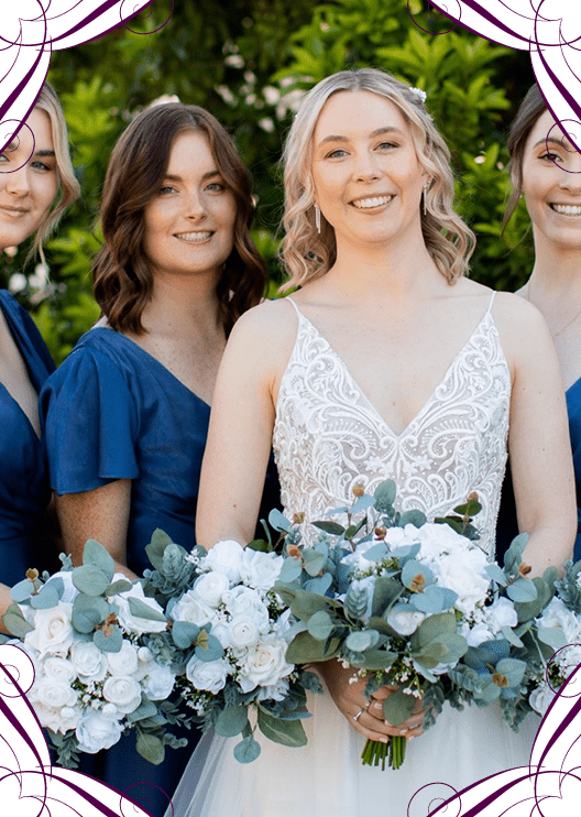 Artificial wedding bouquets held by a bride and bridesmaids, with white faux roses, small white flowers and eucalyptus. Made in Melbourne by Flowers For Ever After, shipping Australia and Worldwide.