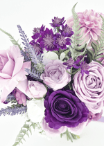 Artificial wedding bouquet close-up with purple and lilac faux roses, pink dahlia, tall purple blossoms and green fern-like leaves. Made in Melbourne by Flowers For Ever After, shipping Australia and Worldwide.