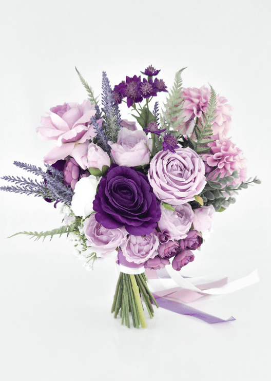 Artificial wedding bridal bouquet, reverse view of lilac and purple faux roses, pink dahlias, purple sprigs and green fern-like foliage. Made in Melbourne by Flowers For Ever After, shipping Australia and Worldwide.