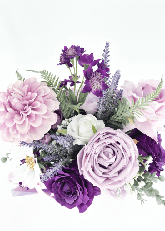 Artificial wedding bouquet, overhead view of lilac and purple faux roses, pink dahlias, white blooms and tall purple sprigs. Made in Melbourne by Flowers For Ever After, shipping Australia and Worldwide.