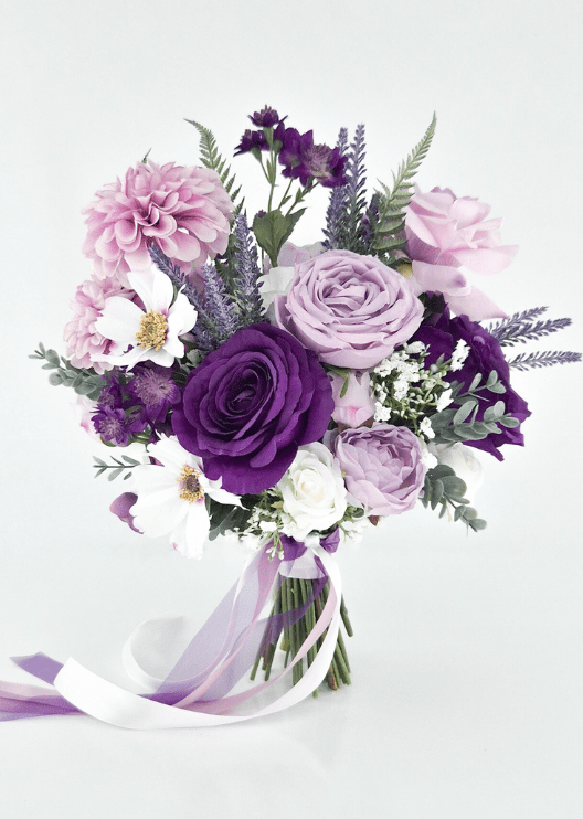 Artificial wedding bridal bouquet with purple and lilac faux roses, pink dahlias, white gold-centred flowers, purple sprigs and trailing white and lilac ribbons. Made in Melbourne by Flowers For Ever After, shipping Australia and Worldwide.