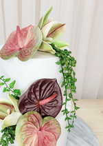Artificial wedding cake flower close-up with pink-green and burgundy faux anthuriums, green orchids and trailing leaves. For birthday, event and celebration cakes. Made in Melbourne by Flowers For Ever After, shipping Australia and Worldwide.