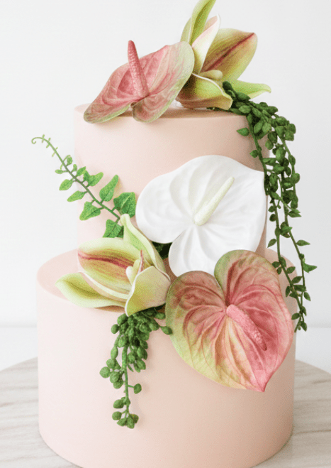Artificial wedding cake decoration with pink-green and white faux anthuriums, green-and-burgundy orchids and trailing leaves. For birthday, event and celebration cakes. Made in Melbourne by Flowers For Ever After, shipping Australia and Worldwide.