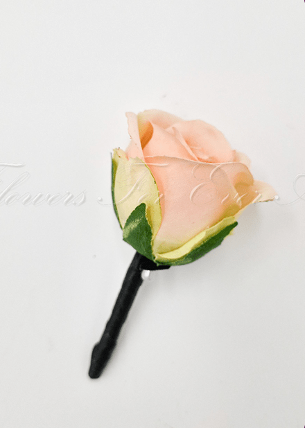 Artificial wedding boutonniere with an apricot faux rose, pale filler flowers and green leaves, with wrapped stems. For formals, proms and ball occasions. Made in Melbourne by Flowers For Ever After, shipping Australia and Worldwide.