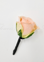 Artificial wedding boutonniere with an apricot faux rose, pale filler flowers and green leaves, with wrapped stems. For formals, proms and ball occasions. Made in Melbourne by Flowers For Ever After, shipping Australia and Worldwide.