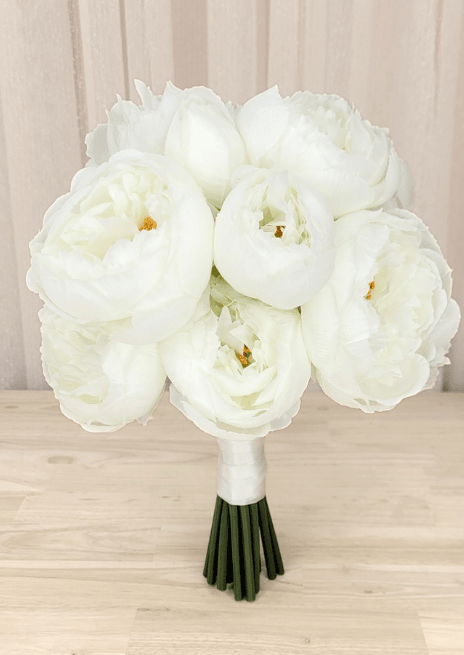 Artificial wedding bridesmaid bouquet with white faux peonies, golden centres and white-wrapped green stems. Made in Melbourne by Flowers For Ever After, shipping Australia and Worldwide.