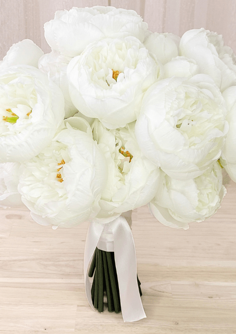 Artificial wedding bridal bouquet with white faux peonies, golden flower centres and white ribbon tails. Made in Melbourne by Flowers For Ever After, shipping Australia and Worldwide.