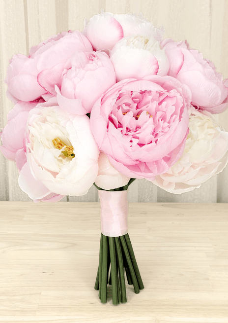 Artificial wedding bridesmaid bouquet with pink and ivory faux peonies, golden flower centres and pink-wrapped stems. Made in Melbourne by Flowers For Ever After, shipping Australia and Worldwide.