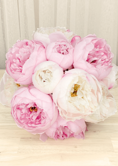 Artificial wedding bouquet, overhead view of pink and ivory faux peonies with golden flower centres. Made in Melbourne by Flowers For Ever After, shipping Australia and Worldwide.