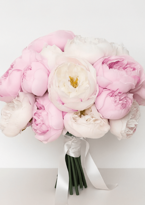 Artificial wedding bridal bouquet with pink and ivory faux peonies, golden flower centres and white ribbon tails. Made in Melbourne by Flowers For Ever After, shipping Australia and Worldwide.