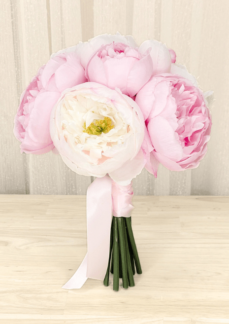 Artificial wedding small bouquet with pink and ivory faux peonies, golden flower centres and pale pink ribbon tails. Made in Melbourne by Flowers For Ever After, shipping Australia and Worldwide.