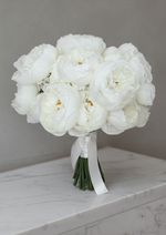Artificial wedding bridal bouquet, full view of white faux peonies, golden flower centres, green stems and white ribbon. Made in Melbourne by Flowers For Ever After, shipping Australia and Worldwide.